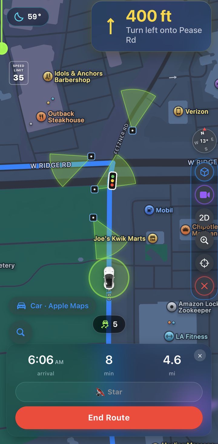 Star Flock GPS during a route: the next turn at the top, lime camera cones along the road, a traffic light on the route, and the arrival card